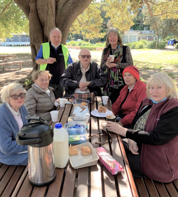 Community Connect Transport users out at a park picnic table